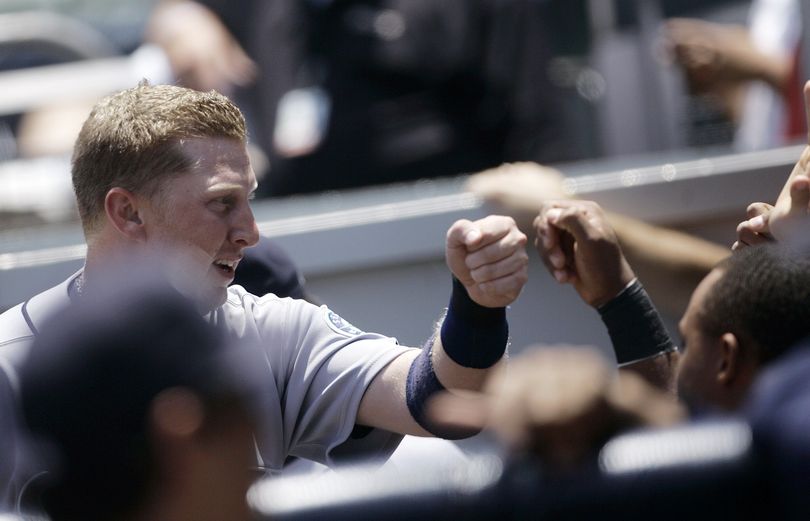 ORG XMIT: CALI103 Seattle Mariners' Mike Carp is congratulated in the dugout after scoring in the first inning on a double by Ken Griffey Jr.during an interleague baseball game against the San Diego Padres, Thursday, June 18, 2009, in San Diego. (AP Photo/Lenny Ignelzi) (Lenny Ignelzi / The Spokesman-Review)