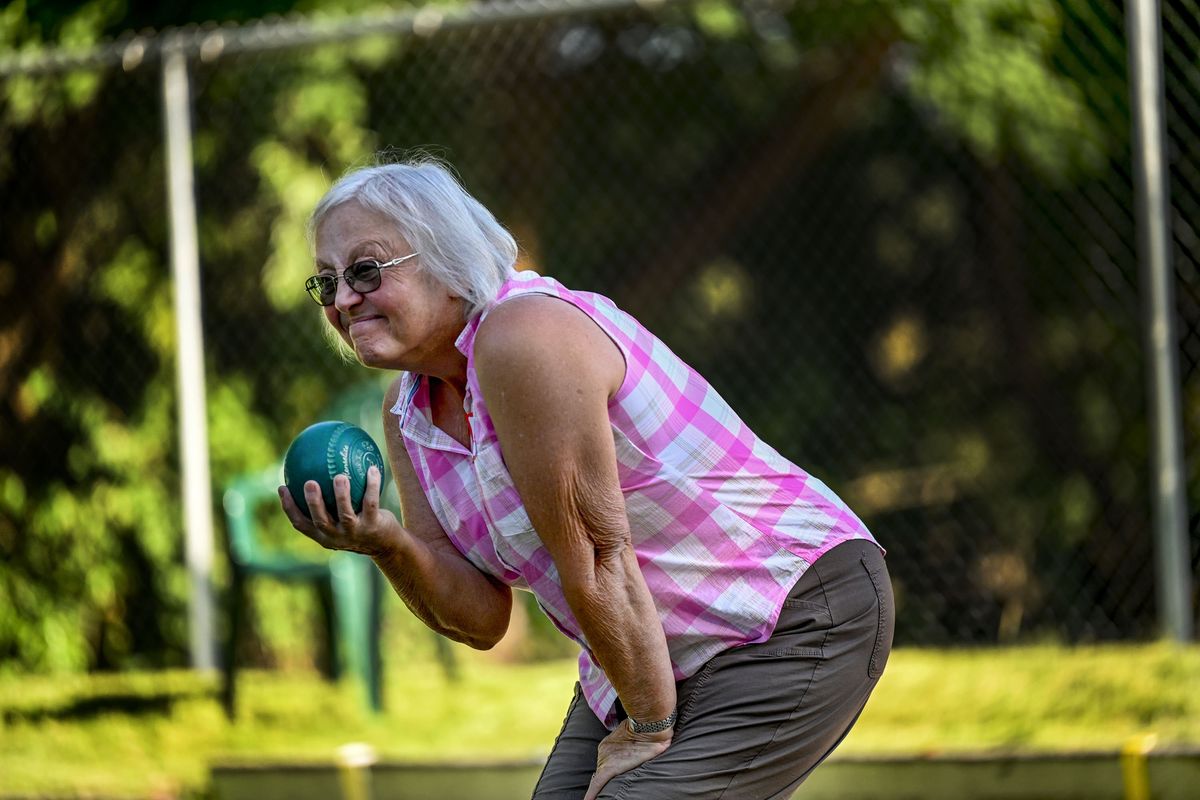 Candee Compogno eyes a shot during a lawn bowling match at Mission Park in Spokane on Aug. 1.  (Kathy Plonka/The Spokesman-Review)