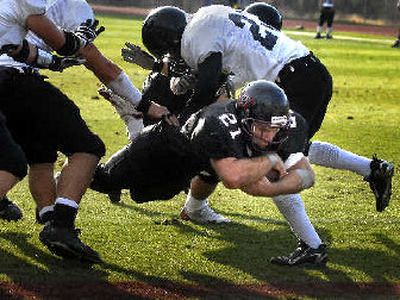 
Whitworth's Kyle Havercroft dives into the end zone for a second-quarter TD on Saturday. 
 (Jed Conklin / The Spokesman-Review)