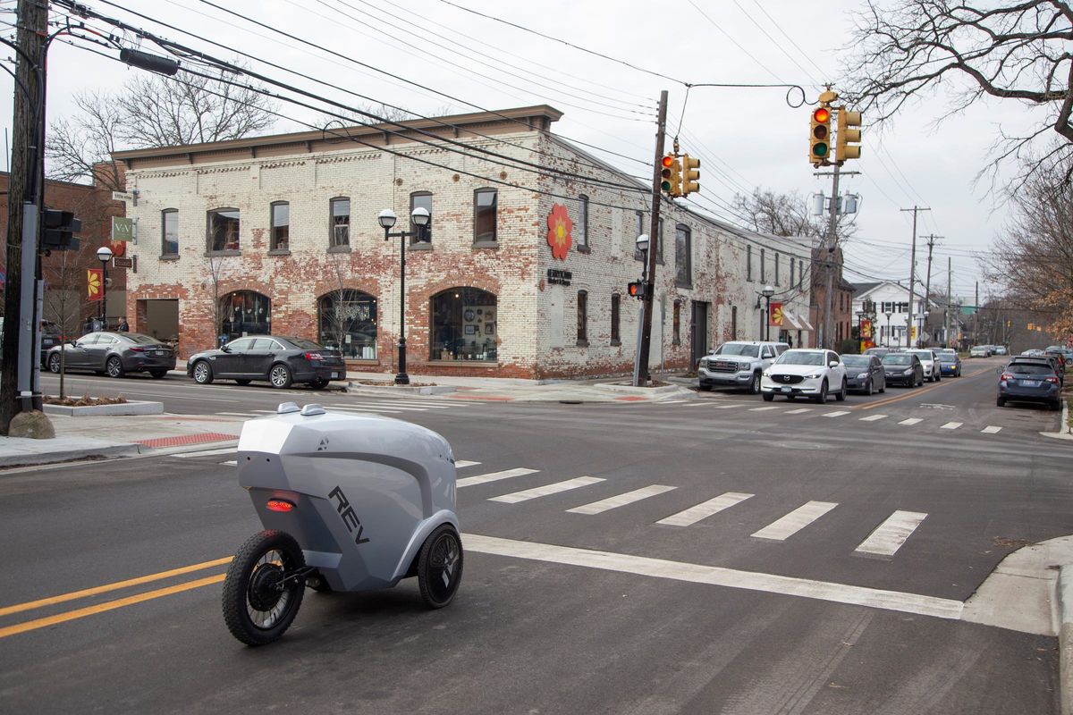 Refraction AI in Ann Arbor, Michigan, has developed an autonomous delivery robot. The first generation Rev1 sits at a red light in Kerrytown while on a mission Wednesday, Jan. 15, 2020 to deliver sandwiches in downtown Ann Arbor.  (Tribune News Service)