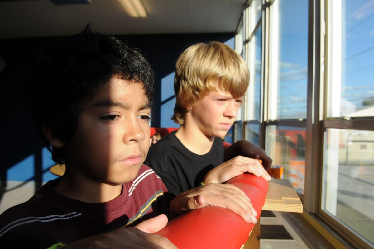 Donovan Davila, left, and Chris Friedman are two of the students connected with volunteer mentors in the Be Great: Graduate program at the Boys & Girls Club.  (Jesse Tinsley)
