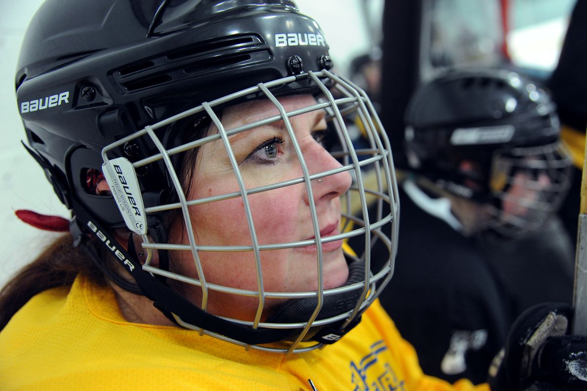 Silver Skaters player Ellen Schwannecke, 50, awaits her chance to hit the ice during a Spokane Women