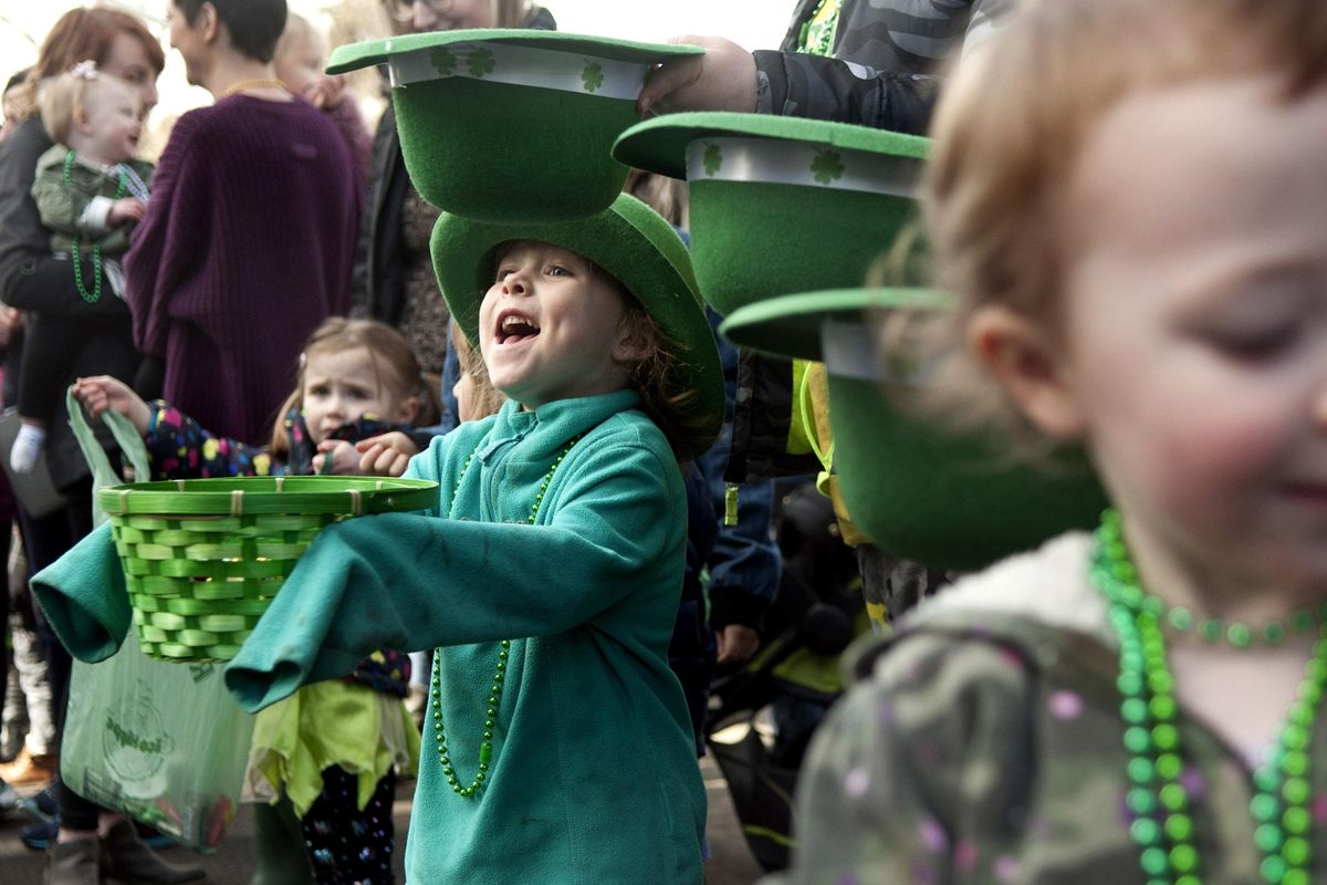 Five-year-old Kylynn Kurth screams for candy during the St. Patricks Day Parade in Spokane on Saturday, March 16, 2019.  (Kathy Plonka / The Spokesman-Review)