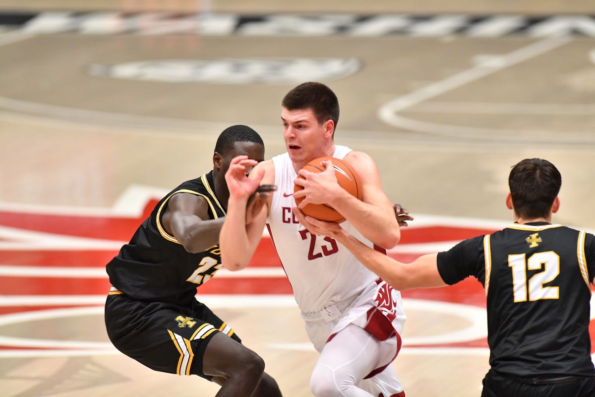 Washington State’s Andrej Jakimovski drives to the hoop during the first half of the Cougars’ rivalry game against Idaho on Dec. 9 at Beasley Coliseum.  (Robert Hubner/Washington State Athletics)