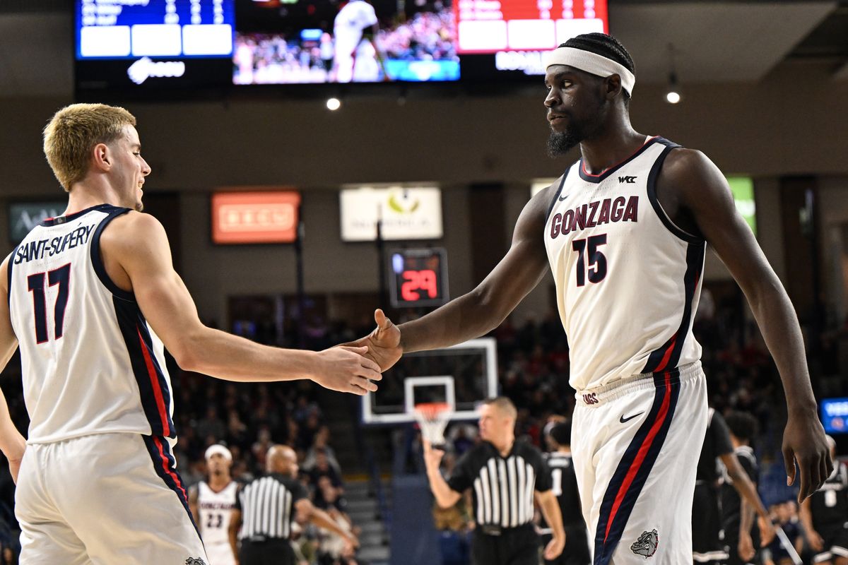 Gonzaga Bulldogs forward Graham Ike (15) high-fives guard Mario Saint-Supery (17) against the Santa Clara Broncos during the second half of a college basketball game on Thursday, Jan 8, 2026, at McCarthey Athletic Center in Spokane, Wash. The Gonzaga Bulldogs won the game 89-77.  (Tyler Tjomsland / The Spokesman-Review)