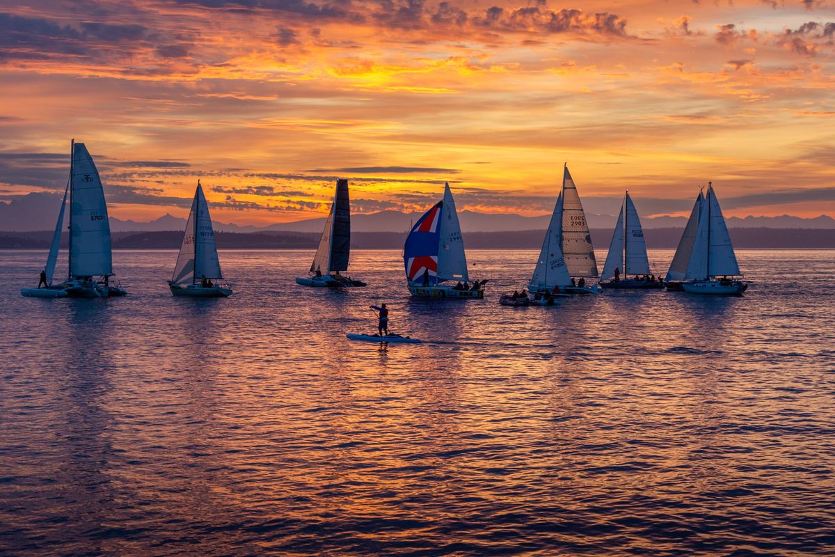 Poised for a 750-mile ocean voyage, entrants in the 2024 edition of the Race to Alaska await the dawn start near Port Townsend, Wash. Yes, the guy on the paddleboard was in the race.  (Courtesy of Kelsey Brenner/Northwest Maritime)