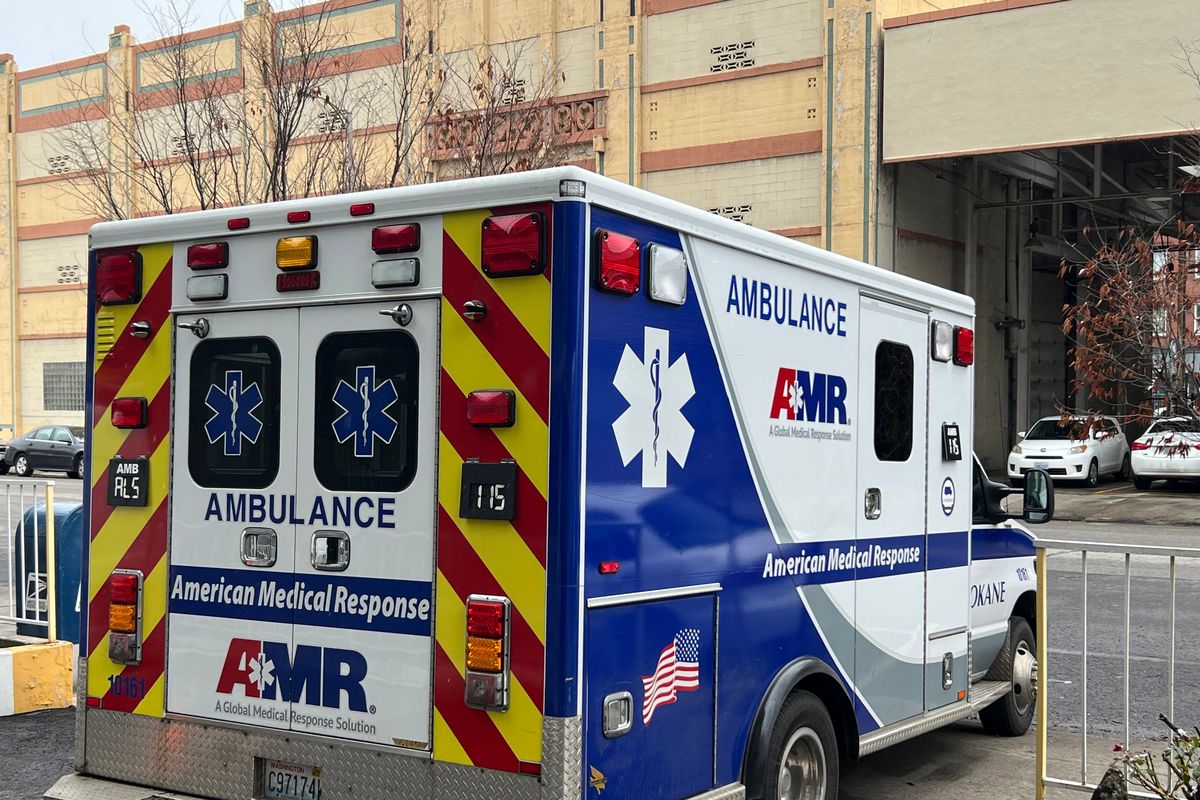 An ambulance from American Medical Response picks up a patient from Cathedral Plaza, AMR provides ambulance hospital transportation service in most of Spokane County. (Jonathan Brunt/The Spokesman-Review)