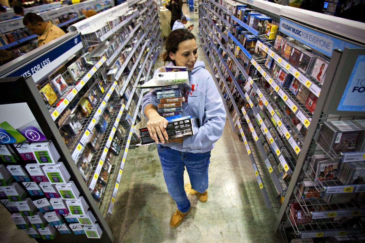 Tonya Thomas, of Russellville, Ky., makes her way through the aisles at Best Buy while shopping for Black Friday deals, Friday, Nov. 23, 2012, in Bowling Green, Ky. Stores typically open in the wee hours of the morning on the day after Thanksgiving that