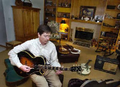 
Bill Burke has two passions: economic and community development, and his guitar collection.      
 (Christopher Anderson/ / The Spokesman-Review)