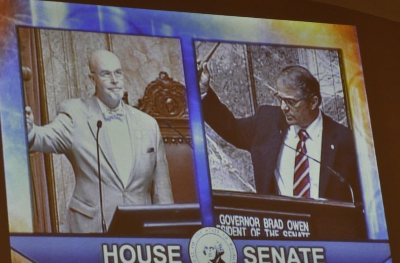 OLYMPIA -- House Speaker Pro Tem Jim Moeller and Lt. Gov. Brad Owen are projected on the Senate while as each brings down the gavel to end the First Special Session Wednesday afternoon.  (Jim Camden)
