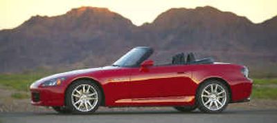 
S2000 is blessed with all the attributes of a great sports car — a suspension with its own nerve endings, steering so sharp it crackles and a mid-engine design that produces superb balance.
 (Honda / The Spokesman-Review)