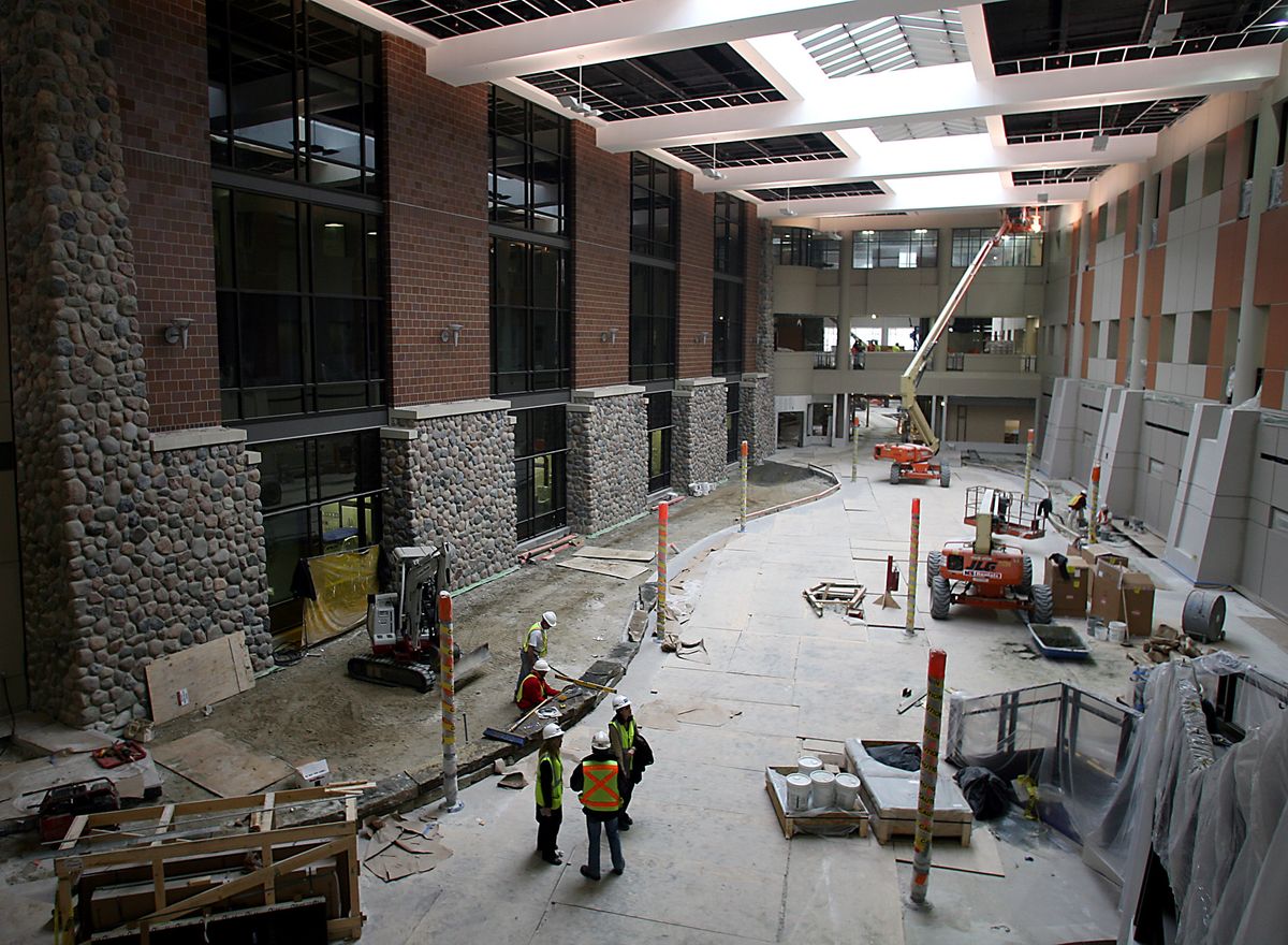 Construction workers continue work in the main atrium at Henry Ford West Bloomfield Hospital in West Bloomfield, Mich. The  atrium will resemble a northern Michigan Main Street complete with storefronts that will offer health and wellness products.  (Associated Press / The Spokesman-Review)