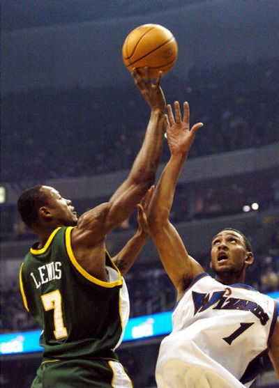 
Washington's Jared Jeffries, right, defends Seattle's Rashard Lewis. 
 (Associated Press / The Spokesman-Review)