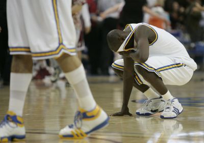 Darren Collison reacts to his Bruins’ defeat at the hands of WSU. (Associated Press / The Spokesman-Review)
