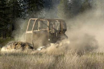 
A bulldozer cuts a fire break at a wildfire Monday near Ford, Wash.
 (The Spokesman-Review)