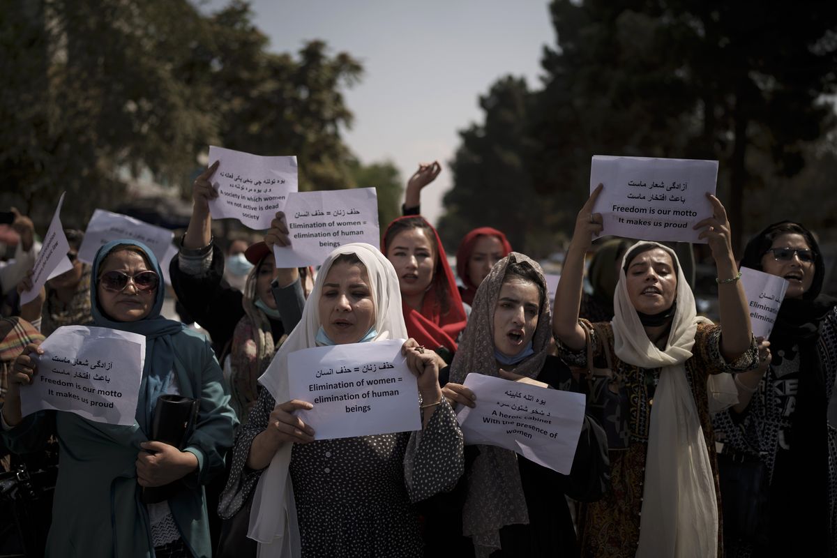 Afghan women march to demand their rights under the Taliban rule during a demonstration near the former Women