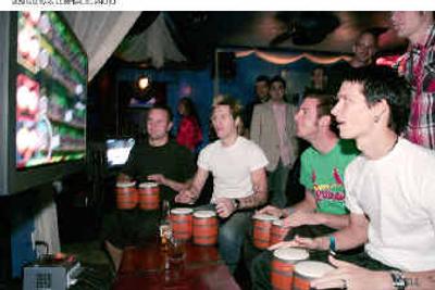 
Band members from Story of the Year gets into the beat with Donkey Konga, a new video game for Nintendo GameCube. 
 (Nintendo / The Spokesman-Review)