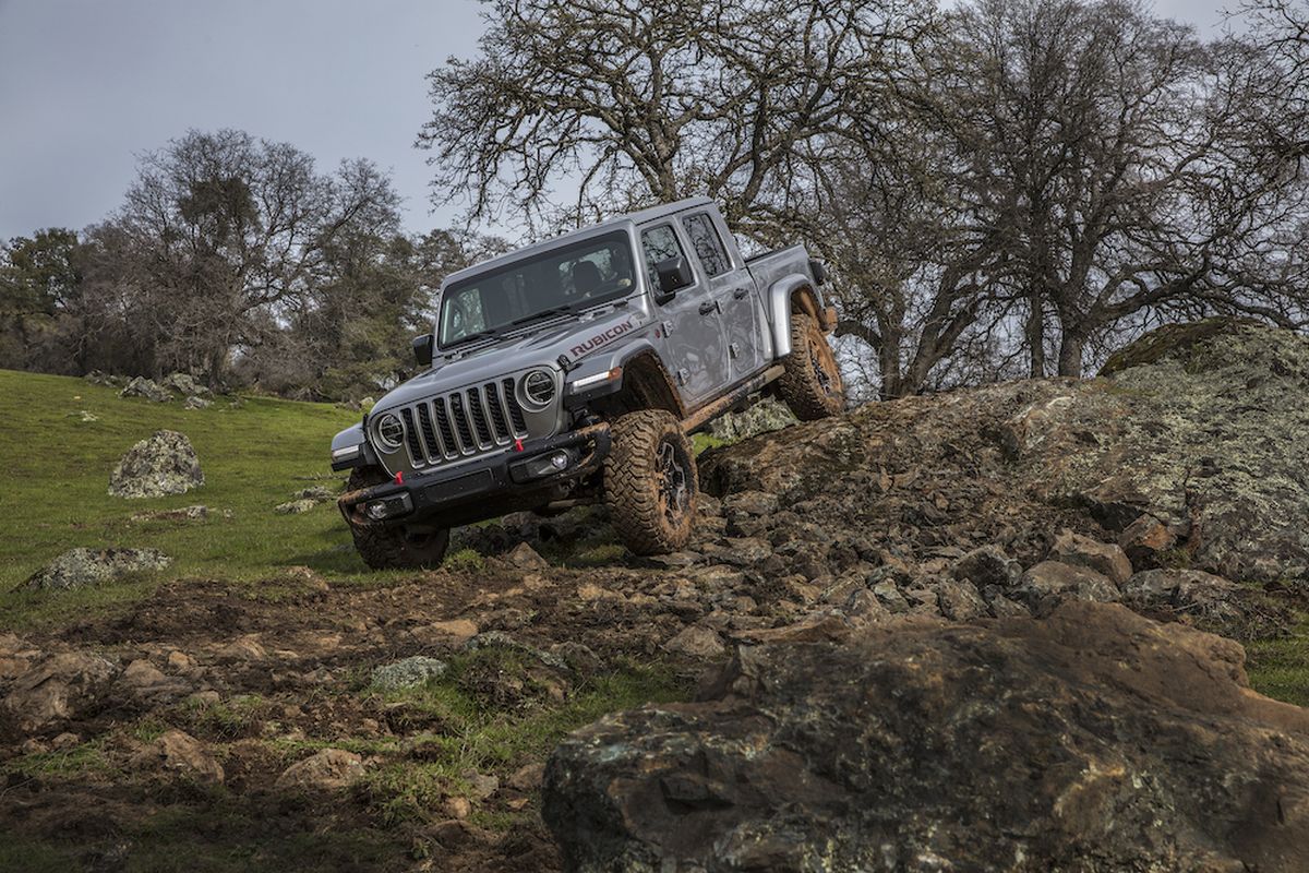 The Gladiator is — take your pick — the Swiss Army knife of pickups or a Transformer toy for big people.  (Jeep)