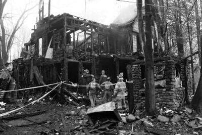 Law officers and emergency workers view the ruins of the burned synagogue in Monsey, N.Y., on Monday.
(Associated Press / The Spokesman-Review)