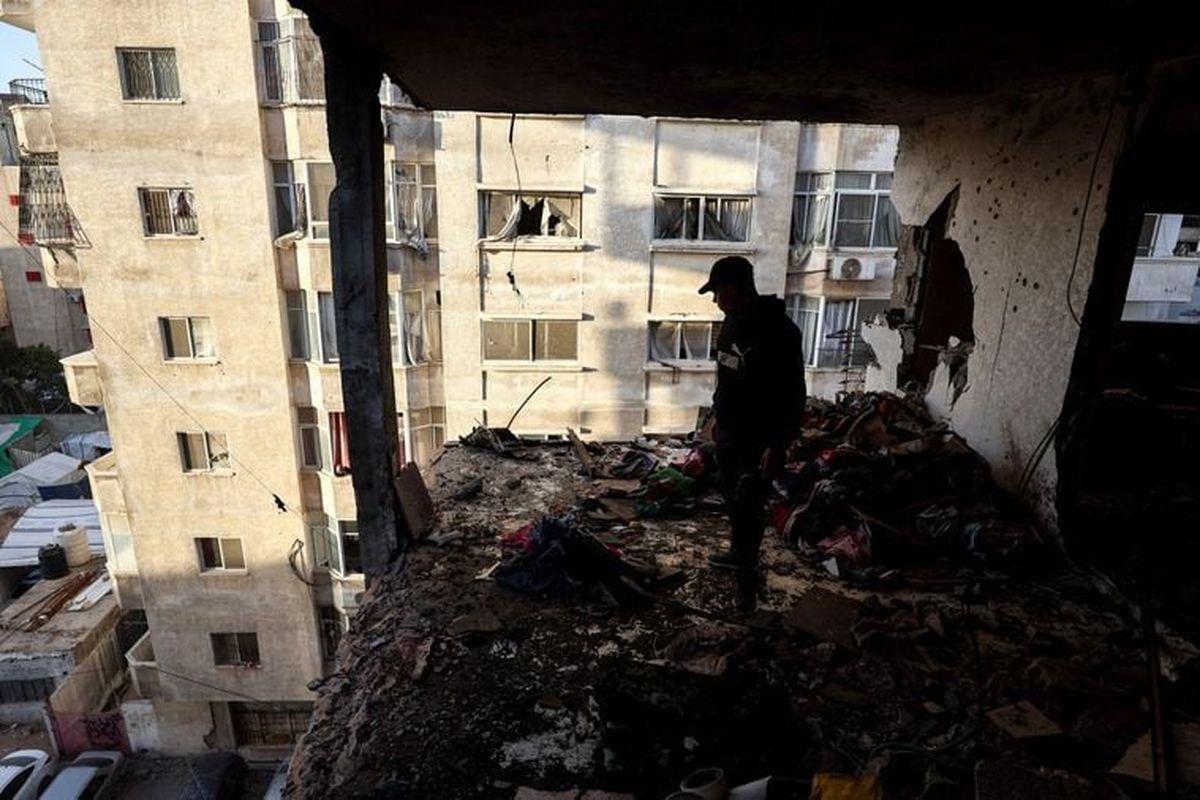 A Palestinian inspects the site of an Israeli strike on Saturday, in Gaza City.  (Reuters )