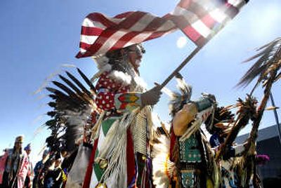 
Native Americans line up for the grand entry of the 18th annual Spokane Falls Northwest Indian Encampment and Pow Wow on Saturday  at Riverfront Park. 
 (Photos by JED CONKLIN / The Spokesman-Review)