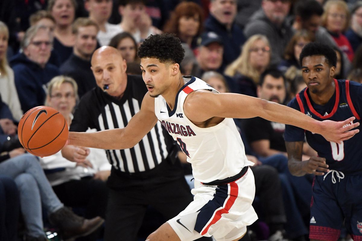 Gonzaga guard Ryan Woolridge (4) steals the ball from Detroit Mercy guard Antoine Davis (0) during the first half of a college basketball game, Mon., Dec. 30, 2019, at the McCarthey Athletic Center. (Colin Mulvany / The Spokesman-Review)