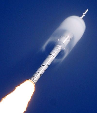 A cone of moisture surrounds part of the Ares I-X rocket during liftoff Wednesday  on a sub-orbital test flight from the Kennedy Space Center.  (Associated Press / The Spokesman-Review)