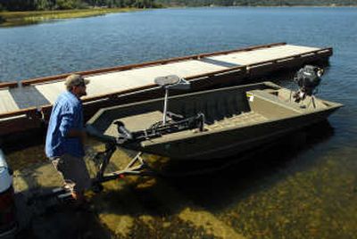 
Willie Mustered launches his boat Tuesday at Hauser Lake. 