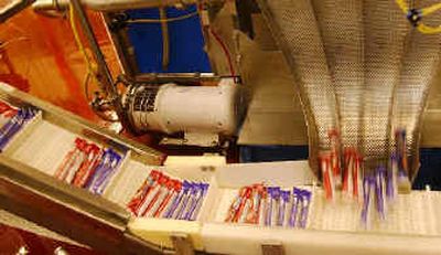 
Squeezers are filled at Stonyfield Farm in Londonderry, N.H. The yogurt-in-a-tube is part of a national trend of packaging to make food products user friendly on the run, no utensils needed. 
 (Associated Press / The Spokesman-Review)