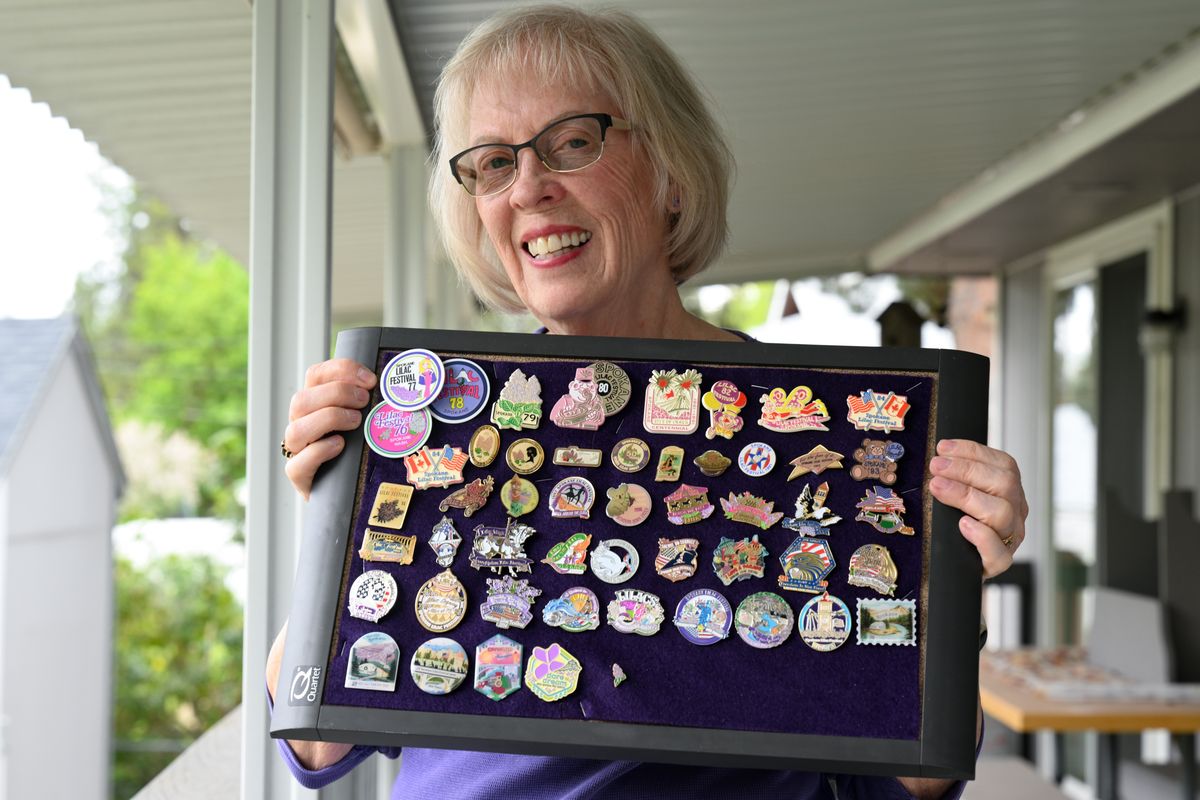 Helen Kennett shows her collection of Lilac Festival pins on May 7 in Spokane.  (Tyler Tjomsland/The Spokesman-Review)
