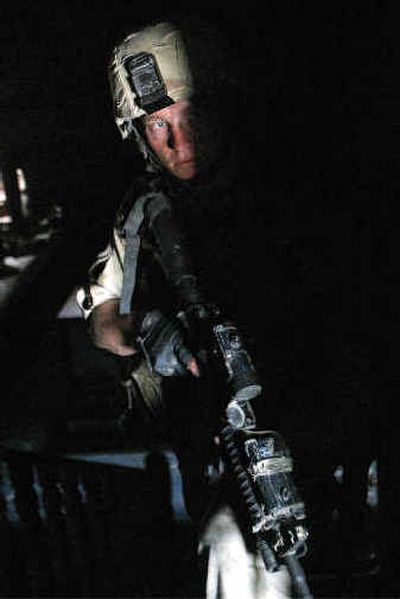 A U.S. soldier searches a building near the Imam Ali Shrine in Najaf on Sunday.
(Associated Press / The Spokesman-Review)
