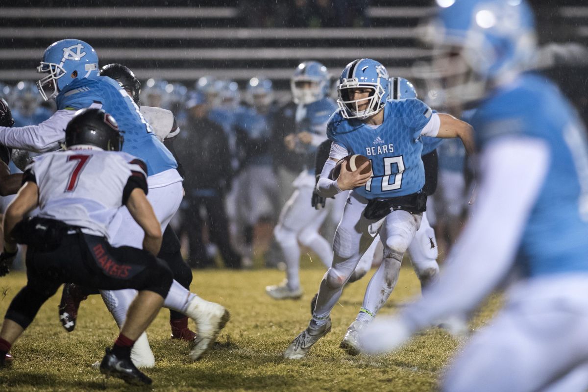 Central Valley QB Grant Hannan (10) runs for yardage against Camas LB Taylor Adams (7) on Friday, Nov. 10. 2017, during a 4A quarterfinal game at Central Valley. CV advanced to a state semifinal with a 22-15 win. (Dan Pelle / The Spokesman-Review)