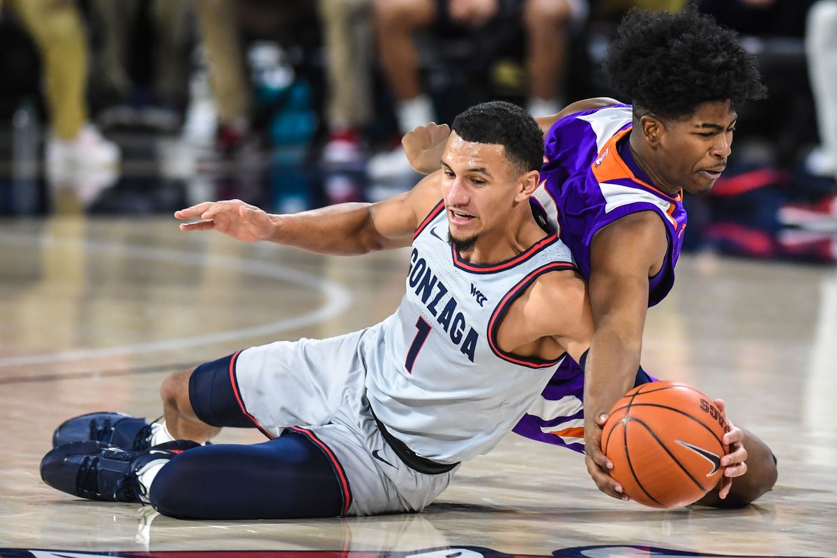Gonzaga guard Jalen Suggs battles for. a loose ball with Northwestern State guard Carvell Teasett,, Monday, Dec. 22, 2020, in the McCarthey Athletic Center.  (Dan Pelle/THESPOKESMAN-REVIEW)