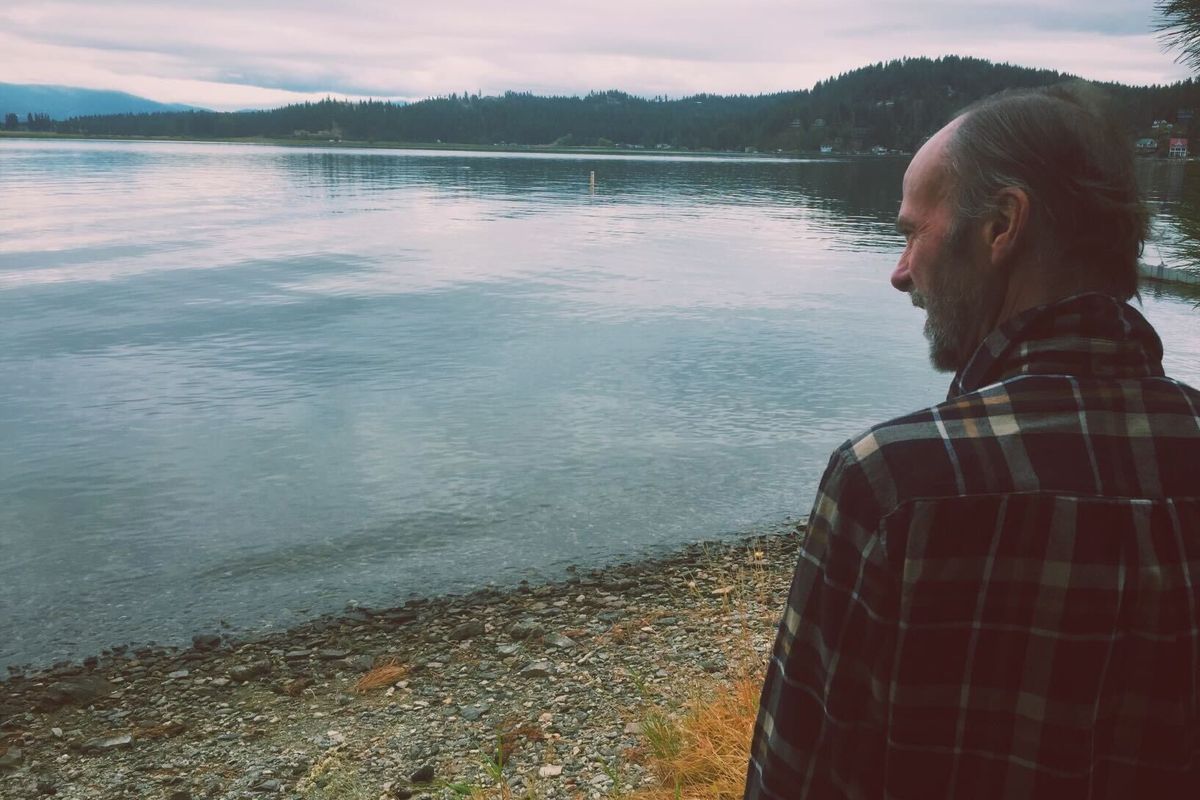 Larry “LT” Taylor stands on the edge of Newman Lake. He died in a house fire on April 30.  (Courtesy of Farah Taylor)