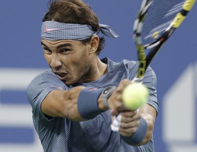 Rafael Nadal returns a shot to Tommy Robredo during a quarterfinal match at the U.S. Open. (Associated Press)