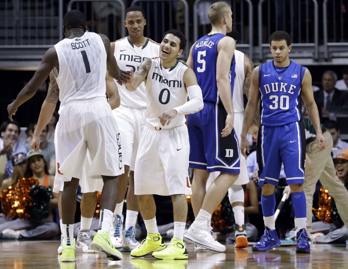 Durand Scott and Shane Larkin (0) have helped lead the rebirth at Miami, where the Hurricanes are playing to packed houses, leading the ACC and are ranked 25th nationally. (Associated Press)