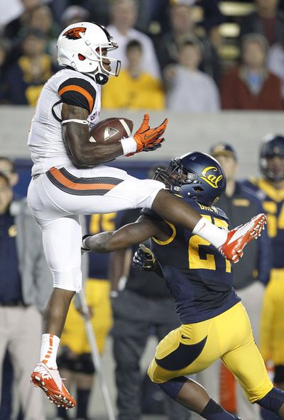 OSU’s Brandin Cooks, left, caught 13 passes. (Associated Press)