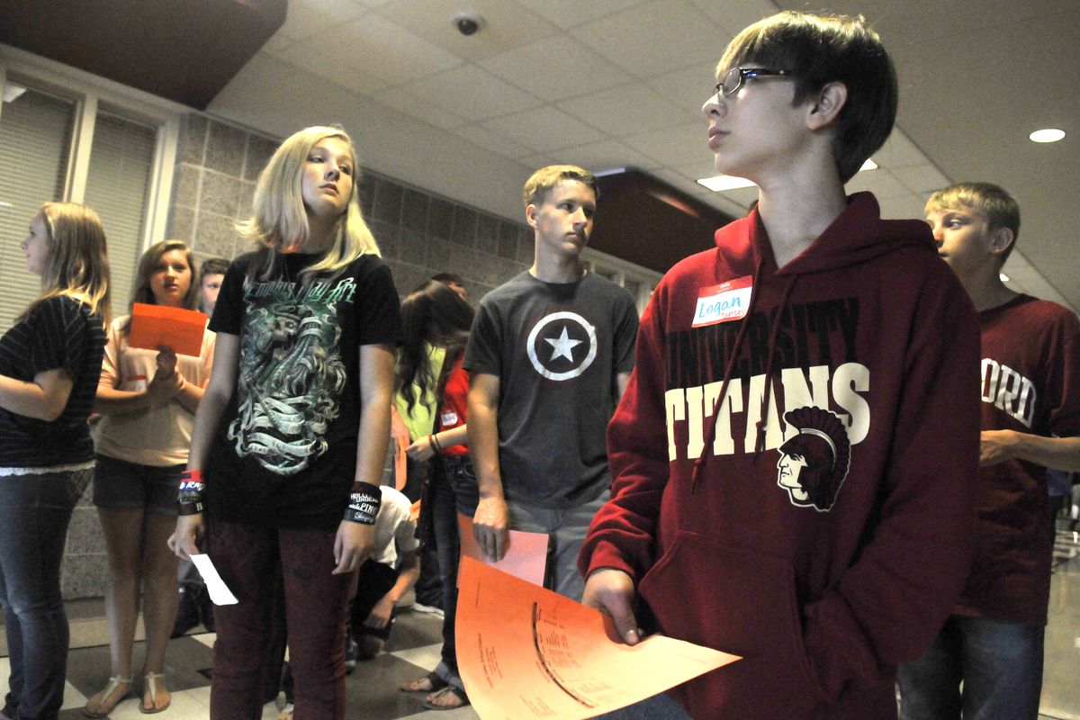 Logan Hoyle, front right, takes a tour with a crowd of other University High freshmen who gathered on Thursday, for an orientation before upperclassmen arrived later in the day. (Jesse Tinsley)