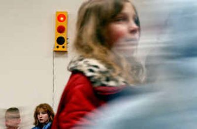 
Students at Athol Elementary School are reminded at lunchtime to quiet down when the light on the Talk Light in the cafeteria turns from green to red. 
 (Kathy Plonka / The Spokesman-Review)