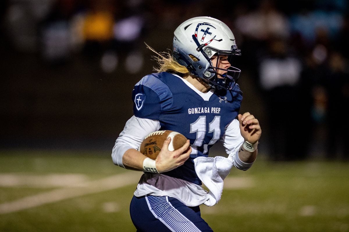 On a kickoff return Gonzaga Prep’s Ryan McKenna runs the ball from about the 20-yard line to the end zone for a Bullpups touchdown against Moses Lake during a high school playoff football game, Friday, Nov. 12, 2021, at Gonzaga Prep.  (COLIN MULVANY/THE SPOKESMAN-REVIEW)