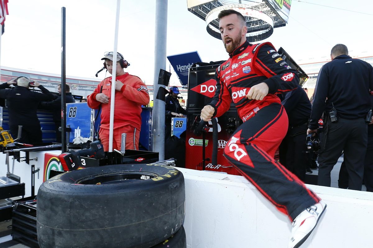 Driver Austin Dillon climbs over the pit wall before practice for a NASCAR Cup Series auto race, Saturday, April 14, 2018, in Bristol, Tenn. (Wade Payne / Associated Press)