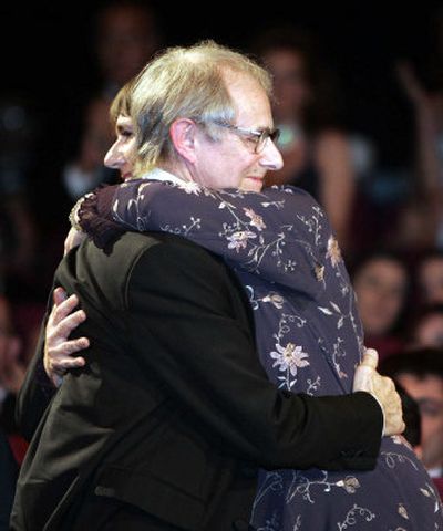 
British director Ken Loach hugs his wife before accepting the Palme d'Or at the Cannes film festival on Sunday. 
 (Associated Press / The Spokesman-Review)