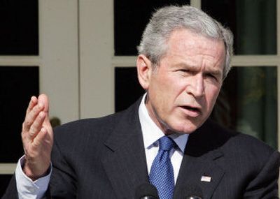 
President Bush, speaking Tuesday in the Rose Garden, brushes off calls for Donald Rumsfeld's resignation. 
 (Associated Press / The Spokesman-Review)