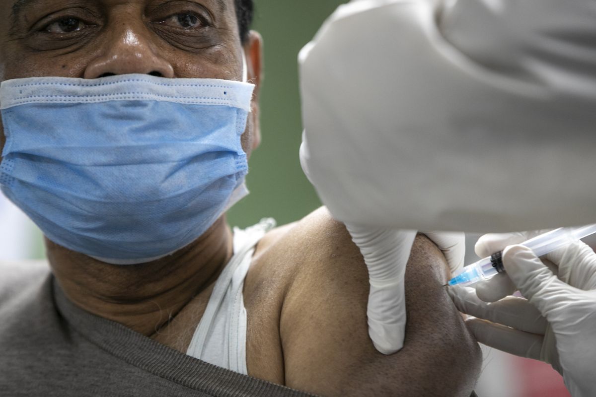 A Nepalese doctor receives the AstraZeneca vaccine Jan. 27 at Teaching Hospital in Kathmandu, Nepal.  (Niranjan Shrestha)
