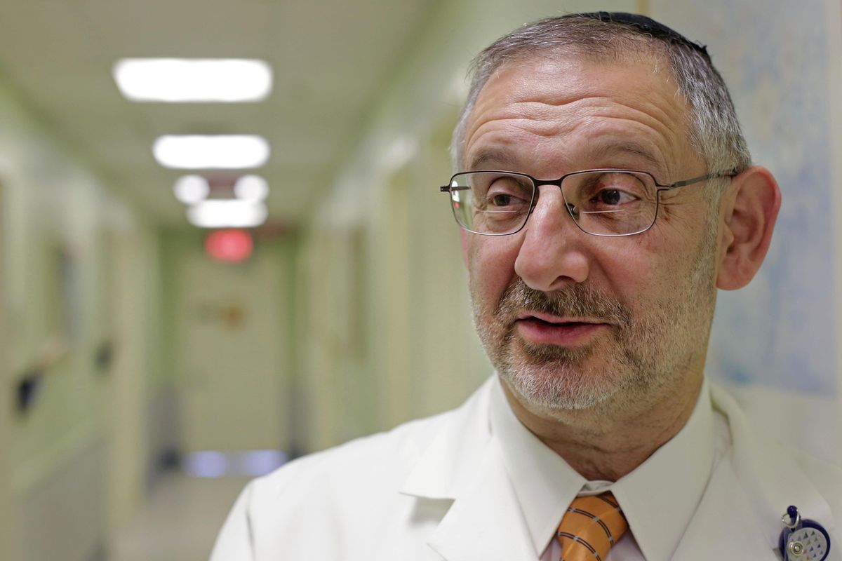 In this Thursday, Dec. 1, 2016, file photo, Dr. Nachum Katlowitz, director of urology at Staten Island University Hospital, stands in a hallway of the hospital in New York. Katlowitz says 90 percent of his patients complain Viagra and Cialis are too expensive. He now prescribes an alternative costing about $1 per pill. (Mark Lennihan / AP)