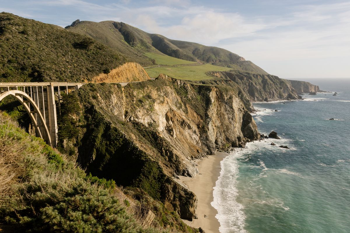 Bixby Bridge, on the Pacific Coast Highway in Big Sur, Calif., on March 17. The natural beauty and recreation opportunities of the coastline can help a frugal traveler enjoy the Monterey area without breaking the bank.  (JASON HENRY/New York Times)