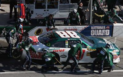 
Dale Earnhardt Jr.'s crew works on his car during the first of two Daytona 500 qualifying races on Thursday. Associated Press
 (Associated Press / The Spokesman-Review)