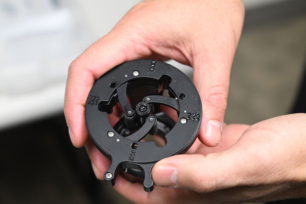 Bullet casings are placed in a holder like this so a machine can take a high-resolution photo of the case’s base to document the markings left by the gun. (Jesse Tinsley/THE SPOKESMAN-REVI)