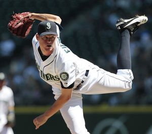 Seattle Mariners starting pitcher Charlie Furbush follows through on a throw to the Oakland Athletics in the second inning of a baseball game Wednesday, Aug. 3, 2011, in Seattle. (Elaine Thompson / Associated Press)