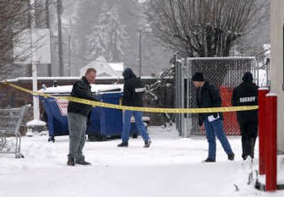 
Investigators search the scene Friday at Third and Thor, near where a Spokane County Deputy Sheriff made a traffic stop. 
 (Dan Pelle / The Spokesman-Review)